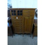 An Edward VII inlaid mahogany music cabinet