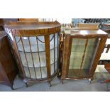 A mahogany display cabinet and a walnut display cabinet