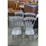 A set of four Victorian painted kitchen chairs