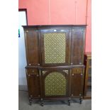 A Regency style mahogany and gilt metal mounted breakfront cabinet