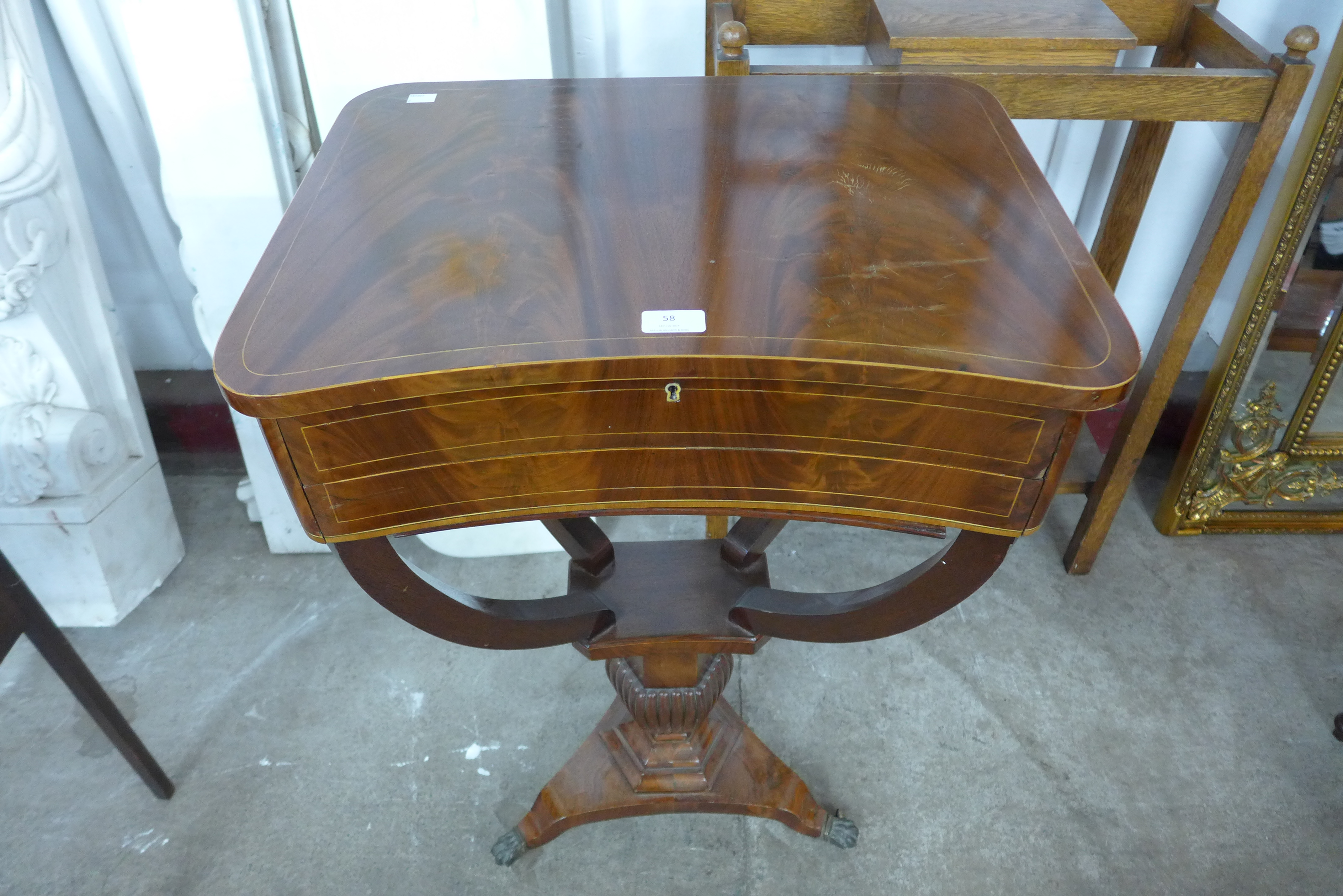 A Regency inlaid mahogany sewing table