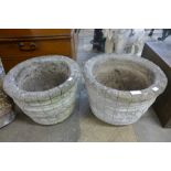 A pair of concrete garden planters