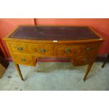 An Edward VII satinwood bow front desk