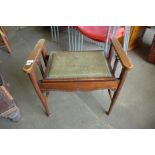 A Victorian inlaid mahogany piano stool