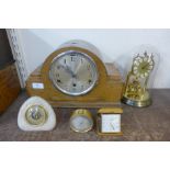 An oak mantel clock, an anniversary clock, a Junghans travel clock, etc.