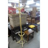 A bentwood coat stand and an oak nest of tables