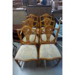A set of six Hepplewhite style dining chairs