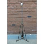 A Victorian Aesthetic Movement burnished steel telescopic floor standing lamp, manner of W.A.S.