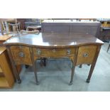 A George III inlaid mahogany serpentine sideboard