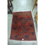 A red ground rug