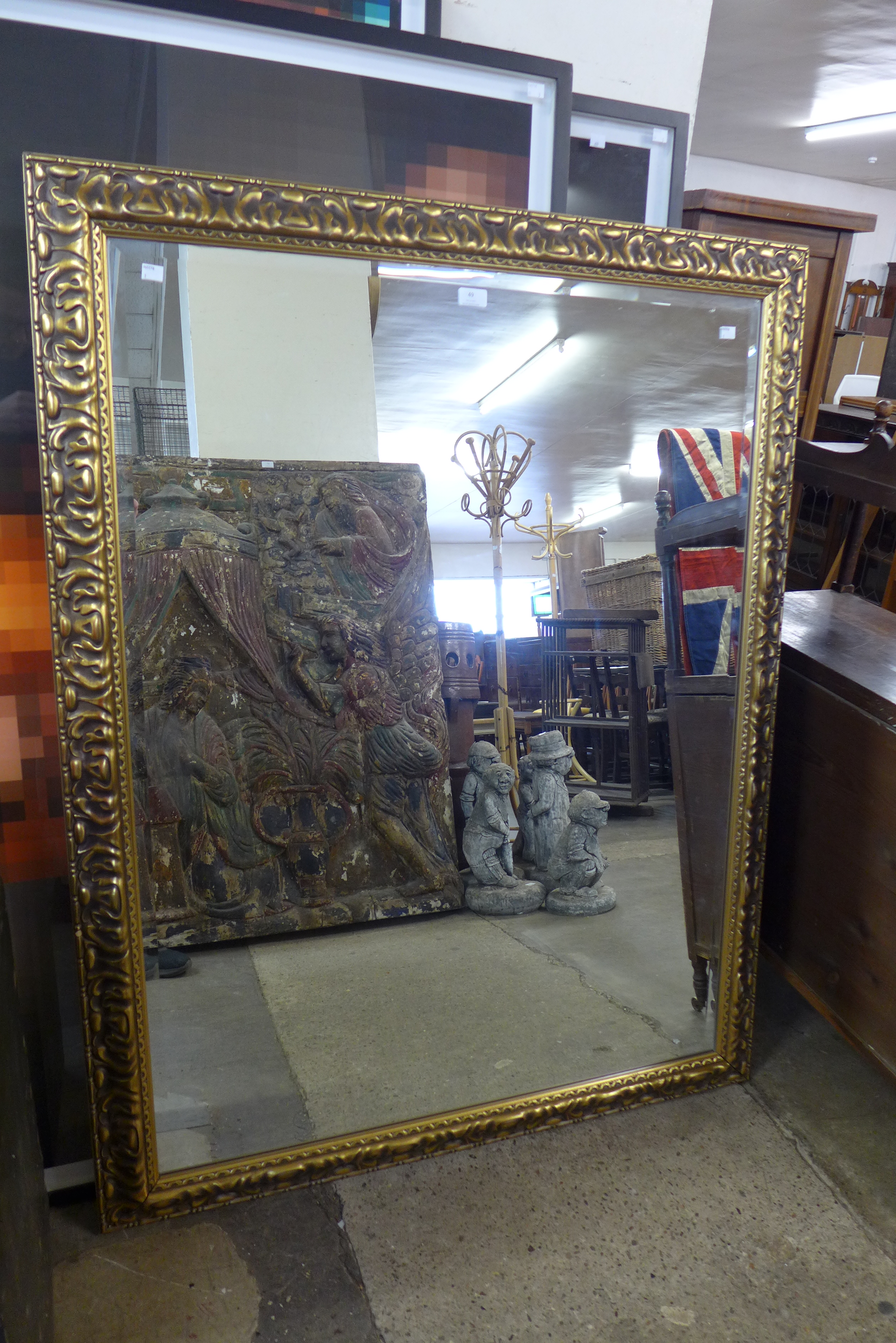 A large gilt framed mirror