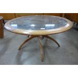 A G-Plan teak and glass topped circular spider leg coffee table
