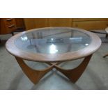 A G-Plan Astro teak and glass topped circular coffee table