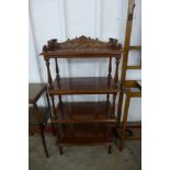 A Victorian style mahogany whatnot