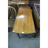 A George II mahogany drop-leaf dining table