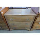 A George III style oak chest of drawers