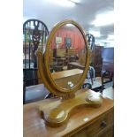 A Victorian satin birch toilet mirror