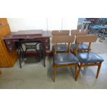 A treadle sewing machine and a set of four chairs