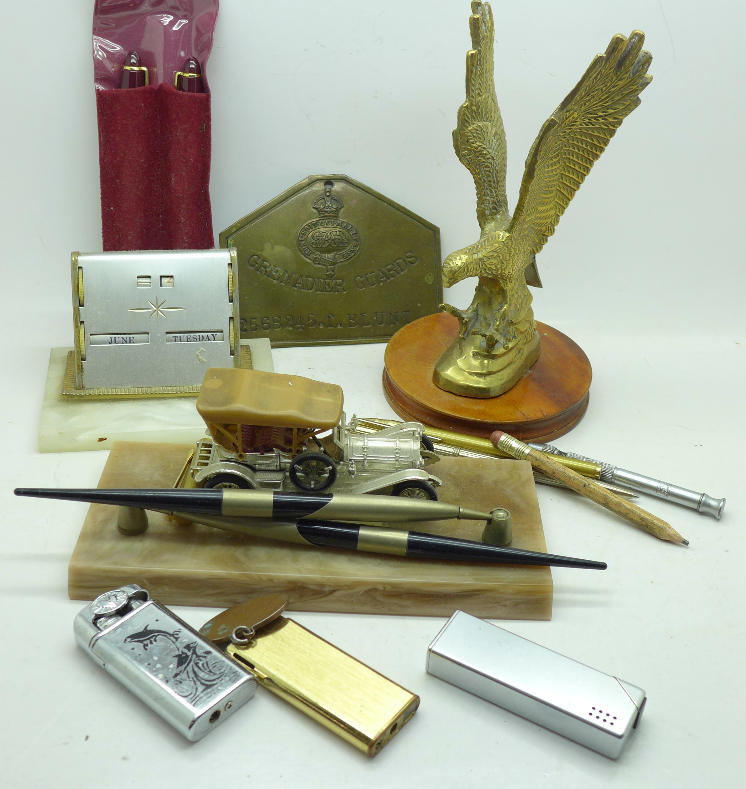 A pen stand, perpetual calendar, three lighters, pen set, pencil, etc.