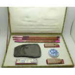 A cased calligraphy set