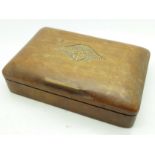 A wooden box with carved RAF motif to the lid,