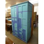 A painted pine two door school cupboard