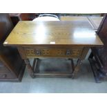 An oak single drawer hall table