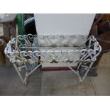 A wrought iron plant stand frame