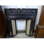 A Victorian aesthetic movement cast iron fire insert