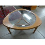 A Nathan teak and glass topped coffee table