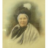 An early 20th Century portrait of a seated lady, overpainted photographic print, framed,