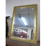 A gilt framed mirror