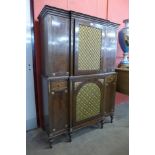 A Regency style mahogany and gilt metal mounted breakfront cabinet