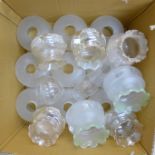 Assorted glass oil lamp shades and a glass chimney