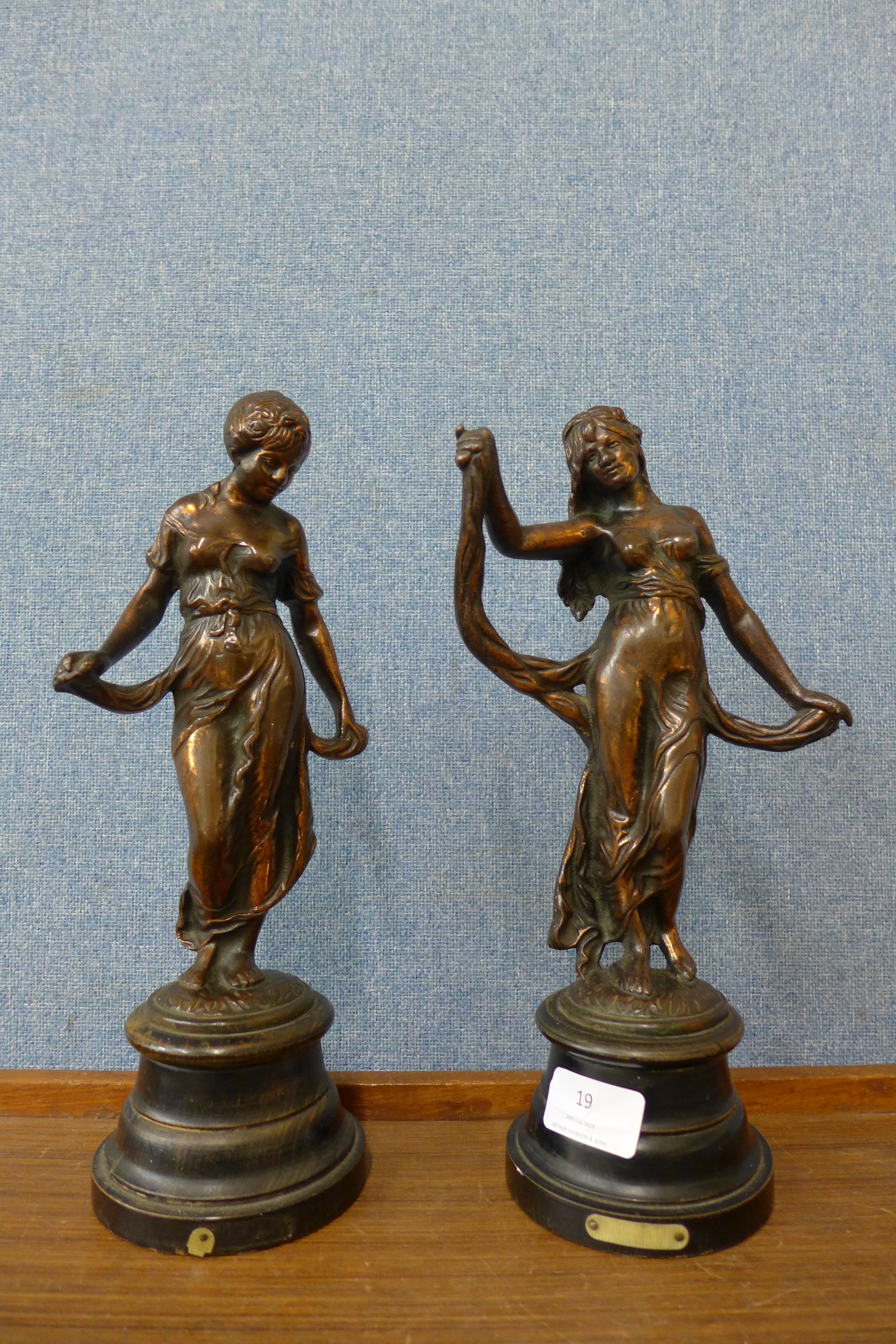 A pair of copper effect metal classical lady figures