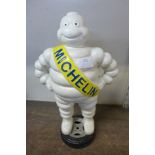 A reproduction cast iron Michelin man advertising figure