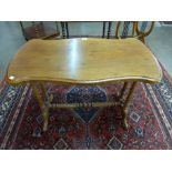 A Victorian walnut serpentine stretcher table