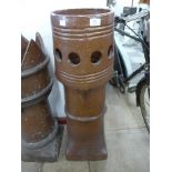 A Victorian salt glazed chimney pot