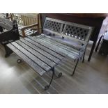 A cast metal garden bench and coffee table