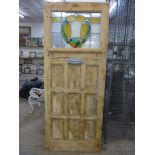 A pine and stained glass door