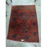 A red ground rug