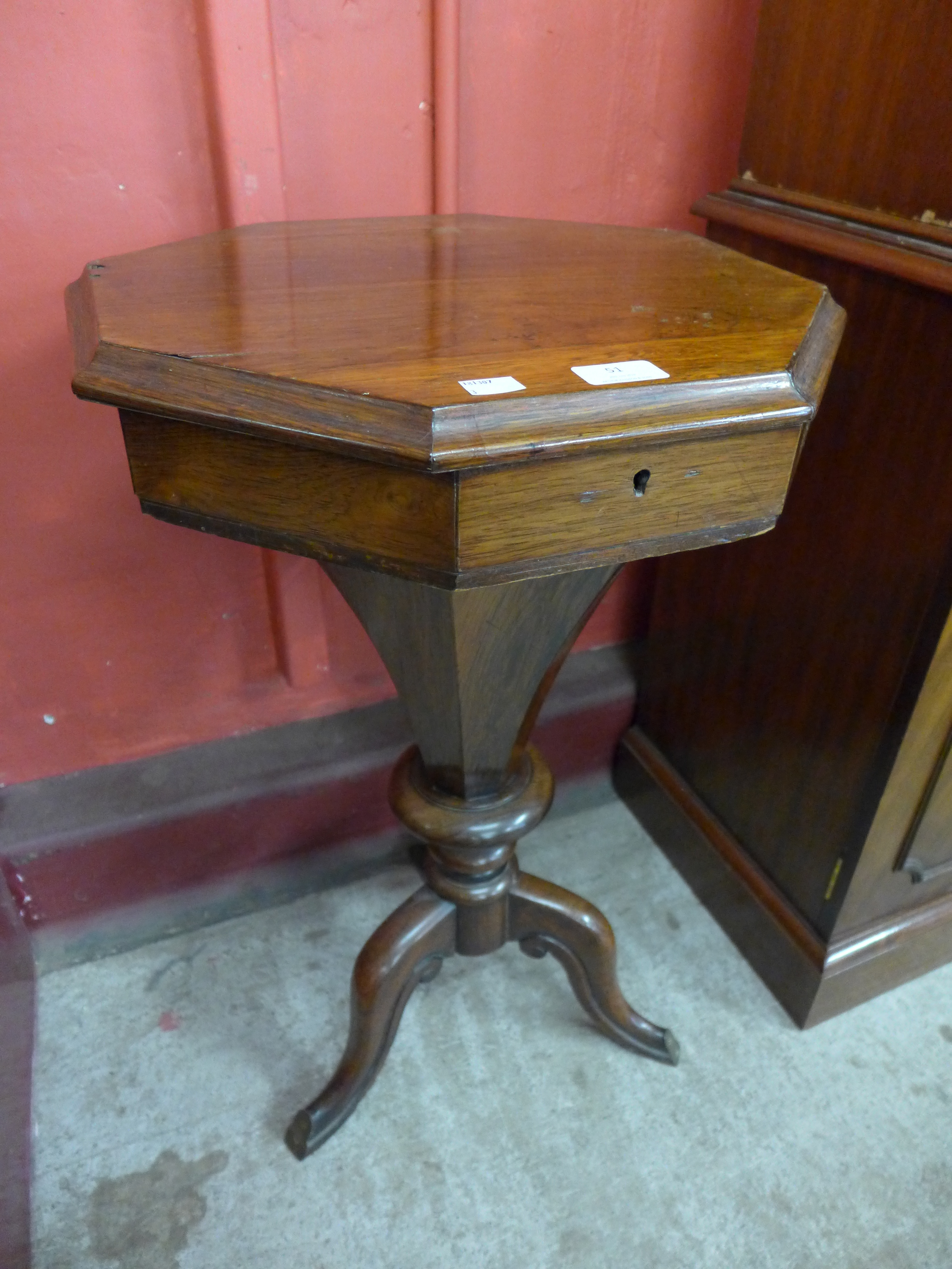 A Victorian rosewood trumpet shaped sewing table