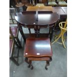 A pair of mahogany corner whatnots and a nest of two tables