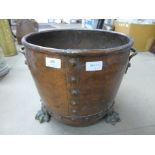 A brass and copper fire log bucket