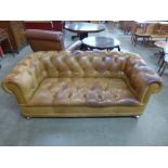 A Laura Ashley brown leather Chesterfield settee