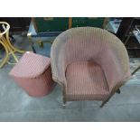 A Lloyd Loom wicker armchair and linen box