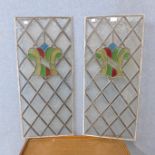 A pair of stained glass panels