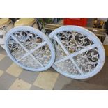 A pair of French style painted circular mirrors