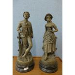 A pair of resin figures of a Victorian lady and gentleman