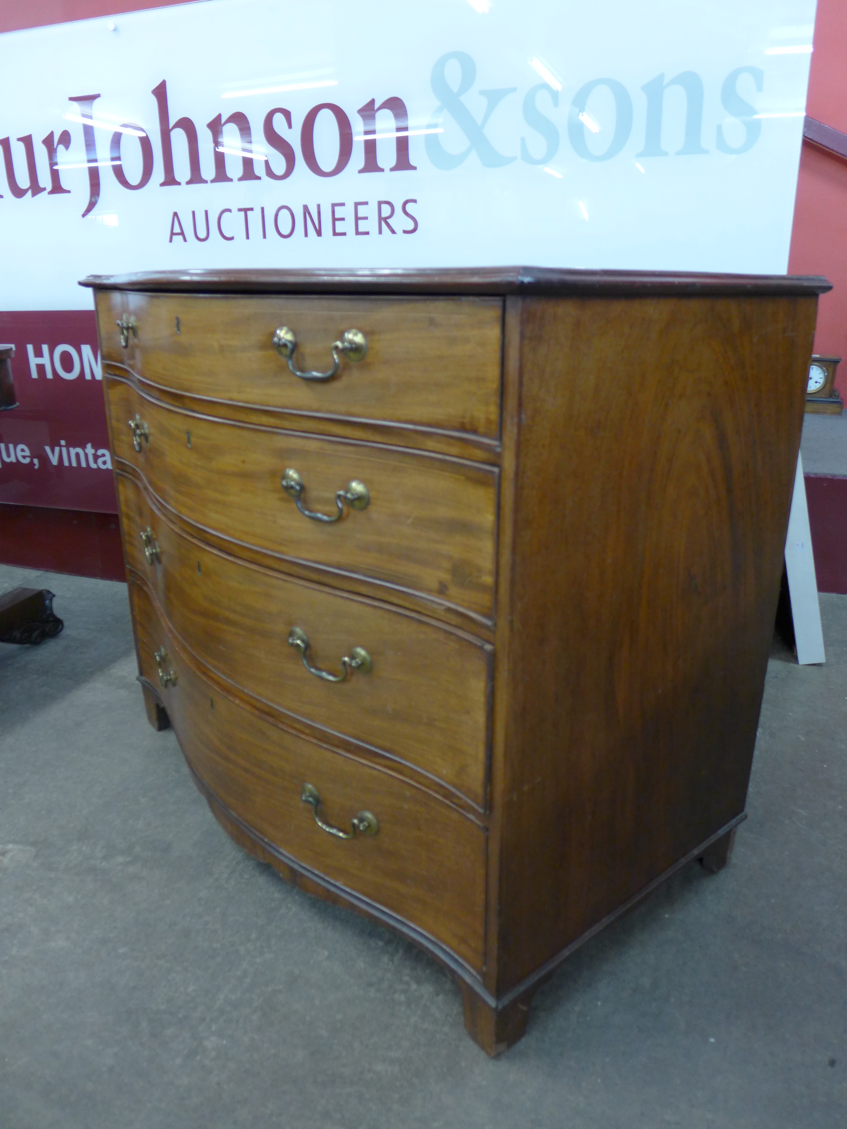 A George III inlaid mahogany serpentine chest of drawers - Image 2 of 2